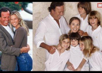 Pareja abrazada junto a un retrato familiar de padres con varios niños y logotipo de revista visible