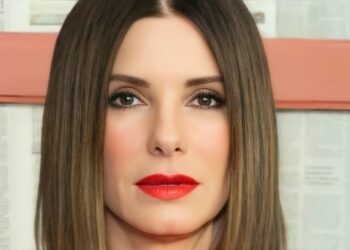 Retrato en primer plano de una mujer con cabello liso y labios rojos, mirada directa y piel impecable