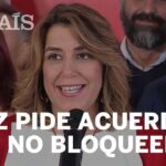Mujer sonriente hablando frente a un micrófono en un acto público con un titular editorial visible sobre acuerdos que no bloqueen.
