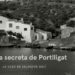 Explora la casa de Salvador Dalí: arte, historia y magia en Portlligat en una fotografía en blanco y negro que muestra casas blancas junto al mar y una persona señalando la bahía.