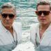 Dos hombres adultos con trajes blancos y gafas de sol en una piscina de tono turquesa, estilo elegante; ¿Quién es la esposa de Brad Pitt? Descubre su historia y secretos