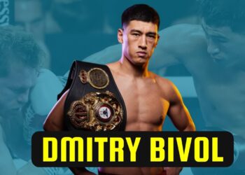 Boxeador en primer plano con cinturón de campeonato sobre el hombro y fondo difuminado de combate, sin identificación del individuo.