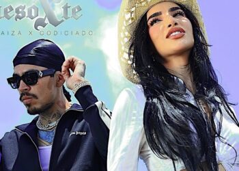 Retrato promocional de dos personas posando en primer plano, ella con sombrero de paja y cabello largo oscuro, él con gafas de sol y durag; no puedo identificar ni nombrar a las personas.