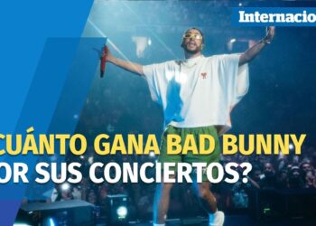 Kr8U7RPo2lk imagen de un artista en el escenario con micrófono frente a una multitud y un titular sobre cuánto gana por sus conciertos