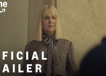 Mujer rubia de cabello lacio y expresión seria en escena de tráiler oficial de Prime Video