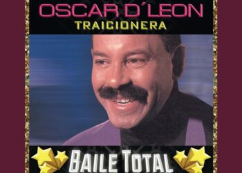 Retrato sonriente de un cantante en portada de álbum de salsa con el texto 'Traicionera', estrellas doradas y diseño retro.
