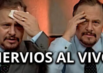 Conductor en traje secándose la frente durante una transmisión en vivo paco stanley