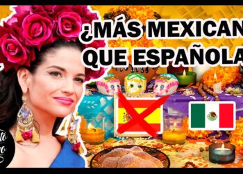 Mujer con corona de flores junto a una ofrenda del Día de Muertos, velas, calaveritas y banderas que sugieren debate sobre identidad cultural