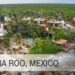 Complejo costero entre palmeras, playa y acantilados con piscina y alojamientos, Patrimonio de Quintana Roo: Descubre su riqueza cultural y natural.