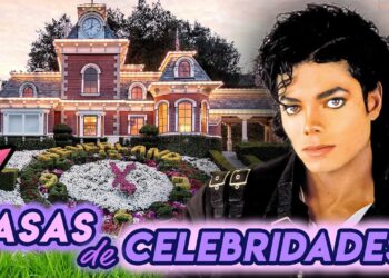 El destino de Neverland: la mansión hoy, fachada iluminada de una residencia señorial con jardín floral y reloj ornamental