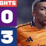 Sueldo de Odriozola: ¿Cuánto gana el lateral del Real Madrid? Jugador del Real Madrid con camiseta naranja celebrando junto a un marcador que muestra 3-0 y el escudo del club.