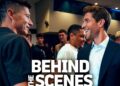 Dos hombres conversando en un evento con público y un gran rótulo 'BEHIND THE SCENES'; ¿Cuánto cobra Sergi Roberto? Descubre su salario actual y más